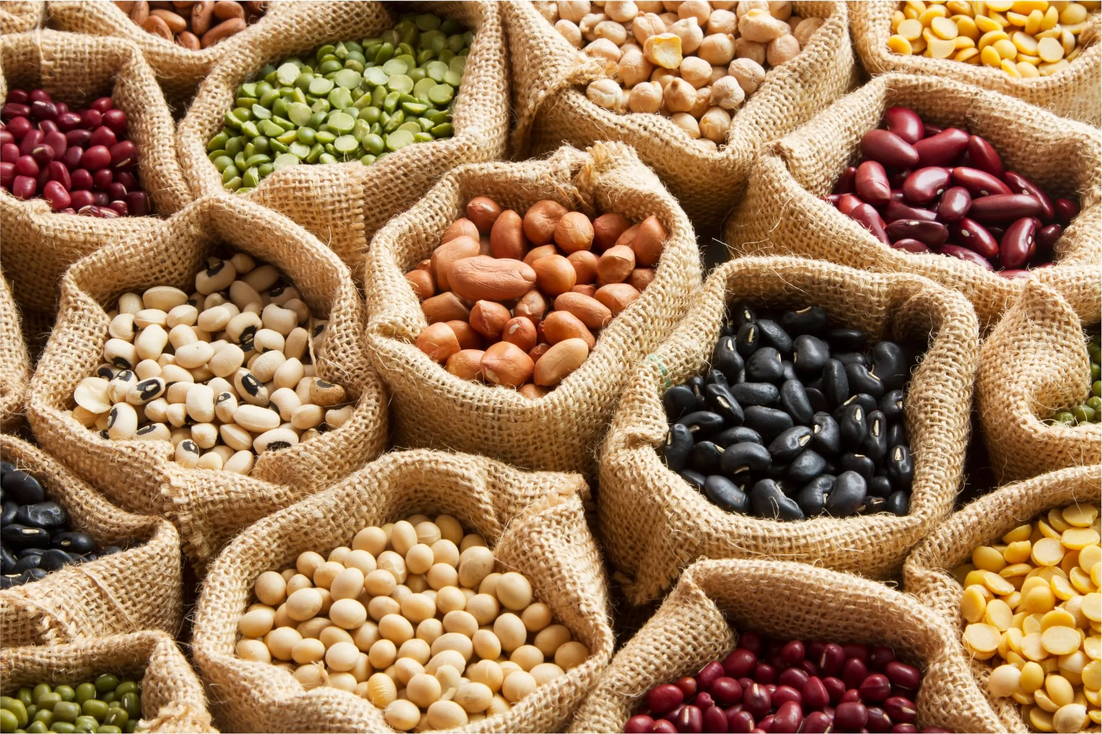 Open sacks of lentils, beans and split peas